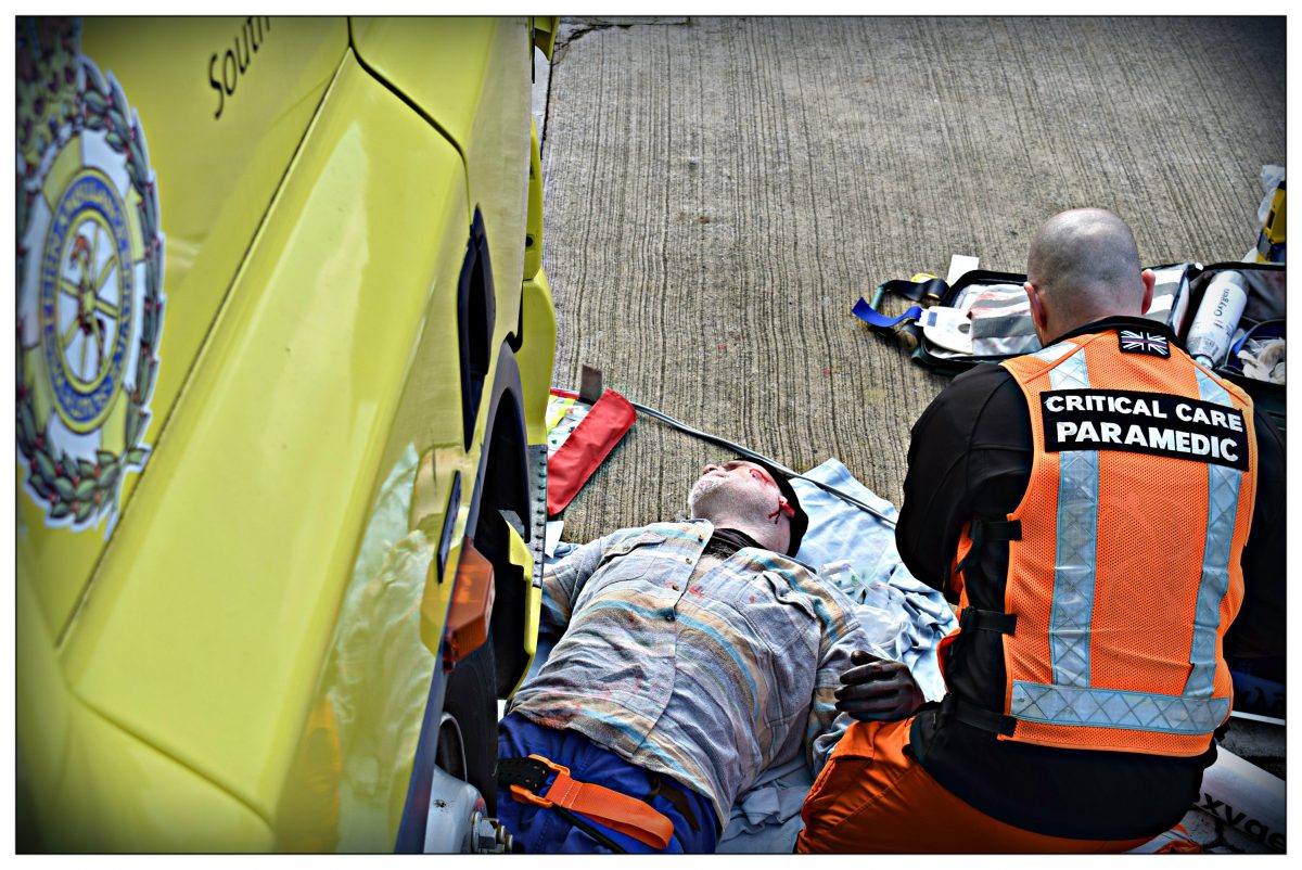 Paramedic treating actor
